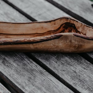 Rustic bread bowl made of olive wood