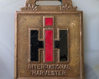 Llavero de latón con publicidad de tractores agrícolas International Harvester antiguos