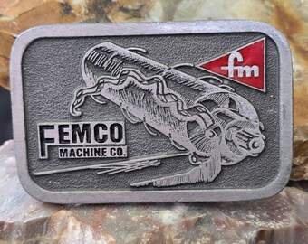 Hebilla de cinturón vintage con publicidad de fábrica esmaltada de Femco Machine Co.