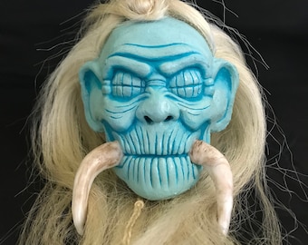 Haunted House Shrunken Head with Pointed Bone