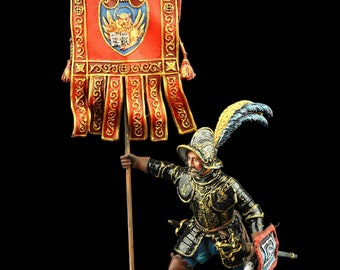 Peut inclure: Figurine miniature d'un soldat en armure ornée, tenant une bannière avec l'inscription "Citta di Venezia". La bannière est rouge avec des bordures dorées et un blason. Le soldat est posé sur une base en pierre, avec une épée et un bouclier.