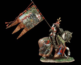 May include: A detailed figurine of a knight on horseback, holding a banner. The banner depicts a scene of a knight slaying a dragon. The knight and horse are adorned with intricate armor and decorative elements, with a black background.