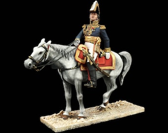 May include: A hand-painted figurine of a military officer on horseback. The officer is wearing a blue uniform with gold trim and a red sash. He is riding a white horse with a red and gold saddle. The figurine is set on a brown base.