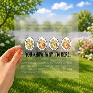 May include: A square, semi-transparent decal featuring four illustrations of deviled eggs in a horizontal row. Below the eggs, the text reads, "YOU KNOW WHY I'M HERE." The design is printed on a clear, frosted material with a repeating watermark.