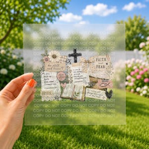 May include: A square, semi-transparent sheet featuring a collage of religious-themed illustrations, including a cross, an open book, and floral accents. Text includes 'Faith over fear', 'Be still and know', and 'I can do all things through Christ'.