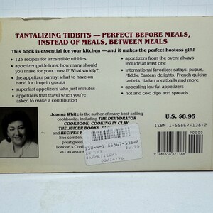 May include: A book cover with a white background and black text. The title is "Tantalizing Tidbits - Perfect Before Meals, Instead of Meals, Between Meals". The book is about appetizers and includes 125 recipes. The author is Joanna White. The book is priced at &pound;8.95.