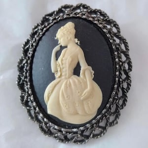 Vintage Oval Cameo Brooch Pin White on Black Antiqued Silvertone Filigree Frame Circa 1980s Frame