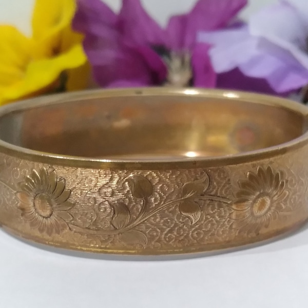 Vintage 1930s Peter Manickas Gold Tone Embossed Brass Bangle Bracelet with Safety Chain and Floral and Leaf Design Art Deco