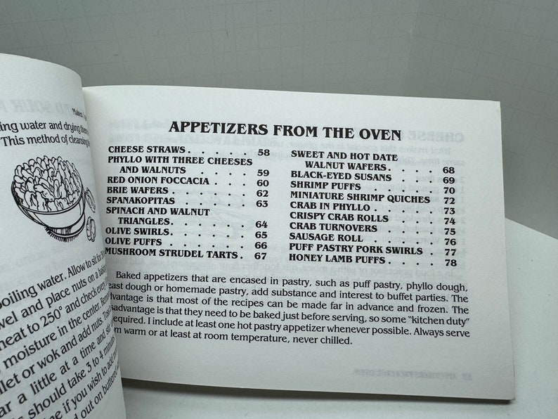 May include: A black and white page from a cookbook with the title "Appetizers from the Oven". The page lists a variety of appetizers with their corresponding page numbers. The appetizers include cheese straws, phyllo with three cheeses and walnuts, red onion focaccia, brie wafers, spanakopitas, spinach and walnut triangles, olive swirls, olive puffs, mushroom strudel tarts, sweet and hot date walnut wafers, black-eyed susans, shrimp puffs, miniature shrimp quiches, crab in phyllo, crispy crab rolls, crab turnovers, sausage roll, puff pastry pork swirls, and honey lamb puffs.