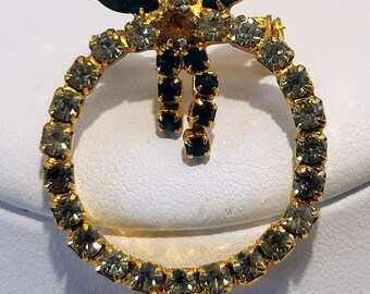 Rhinestone Christmas Wreath Brooch Pin with Bow Multicolor Circa 1980s