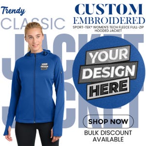May include: A woman wearing a blue Sport-Tek tech fleece full-zip hooded jacket. The jacket has a zipper closure and a hood. The text "YOUR DESIGN HERE" is displayed on the jacket and on a blue circle. The words "Trendy Classic Jacket" are also displayed.
