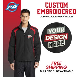 May include: A black and red colorblock raglan jacket with a zipper closure. The jacket has a white embroidered design that says "YOUR DESIGN HERE".