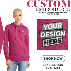 May include: A woman wearing a magenta District Women's Lightweight Fleece Hoodie. The hoodie has a small embroidered design on the chest and a larger design that says "YOUR DESIGN HERE". The image also includes the text "CUSTOM EMBROIDERED" and "SHOP NOW".