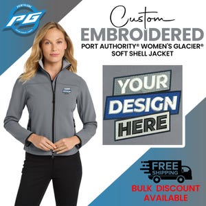 May include: Gray soft shell jacket with black zipper and trim. The jacket has a small embroidered logo on the left chest that says "Your Design Here".
