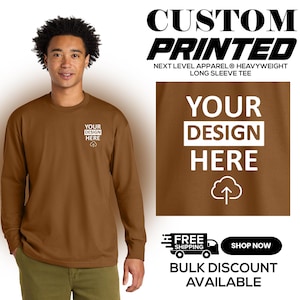 May include: A brown long-sleeve tee shirt with the text "YOUR DESIGN HERE" in white. The shirt is a Next Level Apparel heavyweight long sleeve tee. The image also includes the text "CUSTOM PRINTED".