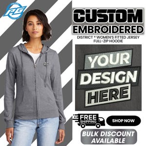 May include: A gray hooded sweatshirt with a zipper. The sweatshirt has a small embroidered logo on the left chest that says "YOUR DESIGN HERE".