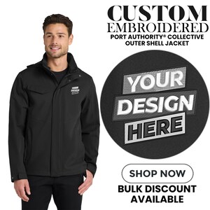 May include: A black Port Authority outer shell jacket with a hood, shown on a person. The jacket has a small logo on the chest and the text "YOUR DESIGN HERE" on a circular graphic. The image also includes the text "CUSTOM EMBROIDERED".