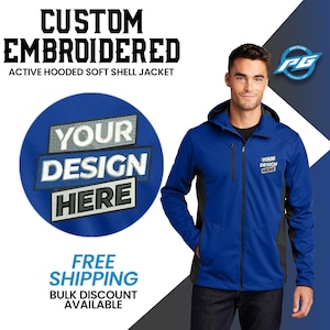 May include: A blue hooded soft shell jacket with a black zipper and black accents. The jacket has a large embroidered area on the left chest that says "YOUR DESIGN HERE".