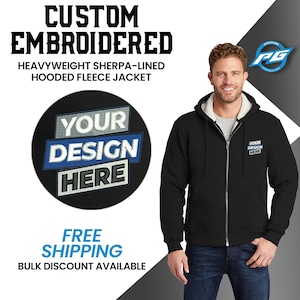 May include: Black hooded fleece jacket with a sherpa lining. The jacket has a zipper closure and two pockets. The jacket is customizable with embroidery. The text "YOUR DESIGN HERE" is displayed on the jacket.