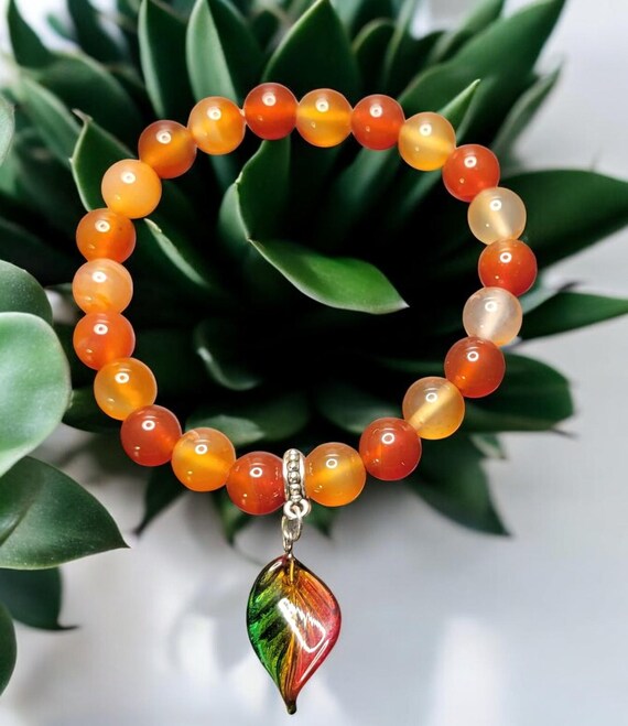 7" Carnelian (8mm) Stretch Bracelet w/Czech Glass Twisted Leaf Charm