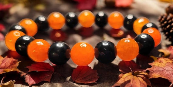 7 1/2" Orange Agate - Faceted (10mm)/Black Onyx (10mm) Stretch Bracelet
