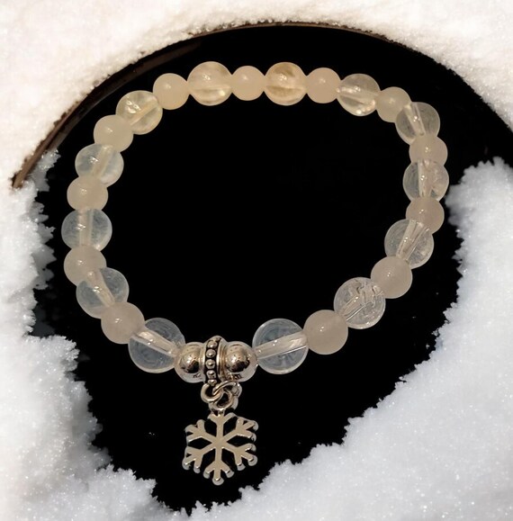 7" Clear Quartz (8mm)/White Jade (6mm) Stretch Bracelet w/Silver Tone Snowflake Charm