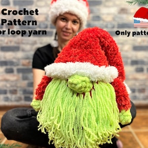 May include: A plush Christmas gnome with a red hat trimmed with white fur and a long, green beard. The gnome is made with loop yarn. Text on the image reads "Crochet Pattern for loop yarn" and "Only pattern".
