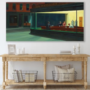 May include: A painting of a diner at night with the sign "PHILLIES" above the window. There are four people sitting at the counter, and the diner is lit by a warm yellow light.