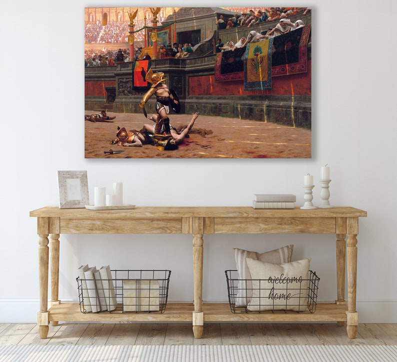 May include: A large canvas print of a historical painting depicting a Roman gladiator scene. The artwork shows a gladiator in golden armor standing over a fallen opponent in an arena, with a crowd in the background. The color palette is dominated by warm tones.