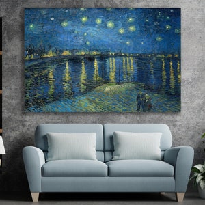 May include: A painting of a starry night over a city with a river reflecting the lights. The painting is in a blue and yellow color scheme with a brushstroke style.