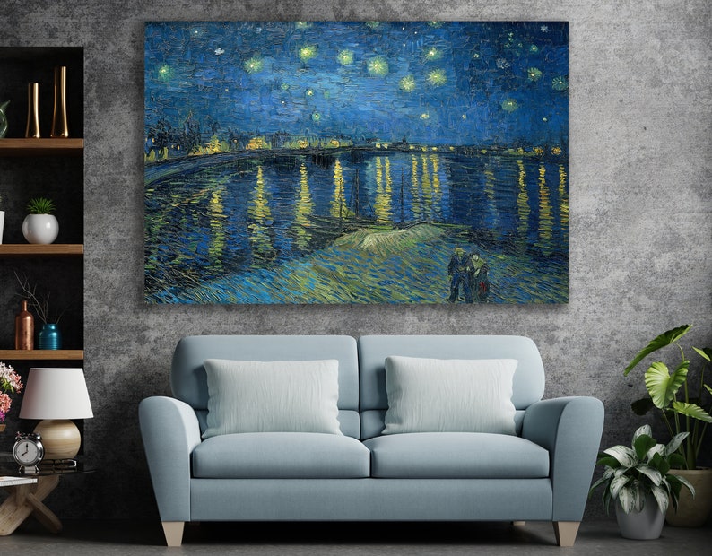 May include: A painting of a starry night over a city with a river reflecting the lights. The painting is in a blue and yellow color scheme with a brushstroke style.