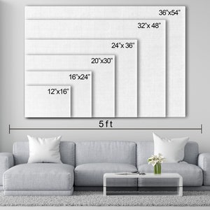 May include: A white canvas print mockup showing different sizes available. The canvas print is displayed on a wall above a gray couch with a coffee table and a plant. The sizes are 12"x16", 16"x24", 20"x30", 24"x36", 32"x48", and 36"x54".
