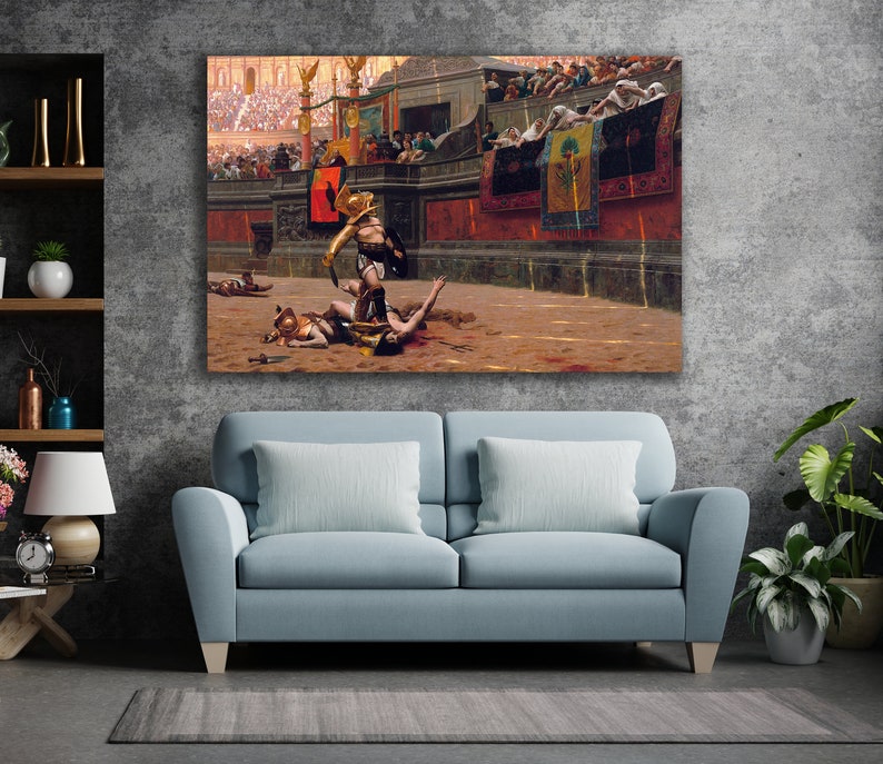 May include: A framed canvas print depicting a historical scene of gladiators in an arena. The artwork features a gladiator in gold armor standing over a fallen opponent, with a crowd in the background. The color palette includes browns, reds, and golds.