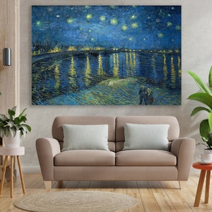 May include: A painting of a starry night sky over a river with a town in the distance. The water is reflecting the lights of the town and the stars. The painting is done in a style reminiscent of Vincent van Gogh.