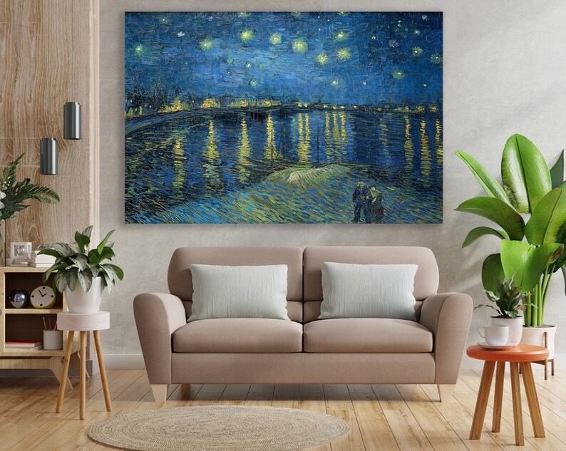 May include: A painting of a starry night sky over a river with a town in the distance. The water is reflecting the lights of the town and the stars. The painting is done in a style reminiscent of Vincent van Gogh.