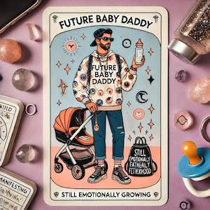 May include: A tarot card illustration depicting a cartoon man wearing a white sweater with a repeating eye pattern, a black baseball cap, and jeans. He is holding a baby bottle in one hand and pushing a stroller with a black bag that says "Still Emotionally Fatheally Fettermoood" on it. The card is titled "Future Baby Daddy" and has the text "Still Emotionally Growing" at the bottom.