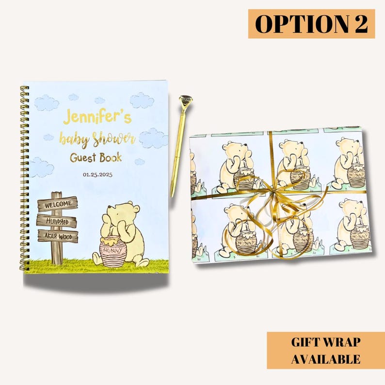 A baby shower guest book with a spiral binding, featuring a Winnie the Pooh illustration. The cover reads "Jennifer's baby shower Guest Book 01.25.2025." A gold pen and a wrapped gift with a Winnie the Pooh pattern are also present.