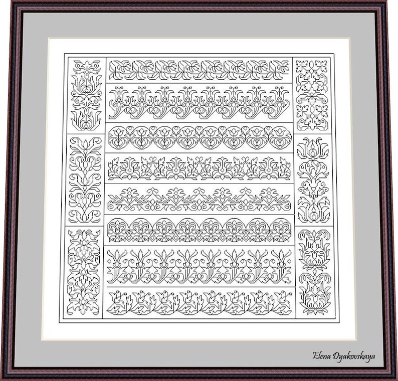 May include: A framed black and white cross-stitch pattern featuring various floral and ornamental border designs. The artwork is displayed in a brown frame with a white matting, showcasing the intricate details of the needlework.