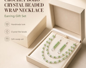 May include: A jewellery set in a beige box featuring a wrap necklace and matching drop earrings made of alternating clear and green crystal-like beads. The text reads: CROCHET BOHO CRYSTAL BEADED WRAP NECKLACE, Earring Gift Set, Handmade look, Crystal-like beads, Gift-ready set.