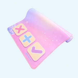 May include: A rectangular desk mat featuring a pink and purple gradient background with a subtle star pattern. Three light yellow square icons are displayed, containing a pink X, a blue plus sign, and a purple checkmark. The text Starberry is visible.