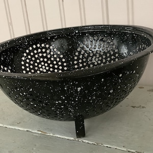 9 1/2  Inch round and 4 1/2 inches tall/1960’s Vintage Speckled Black Enamelware Footed Colander