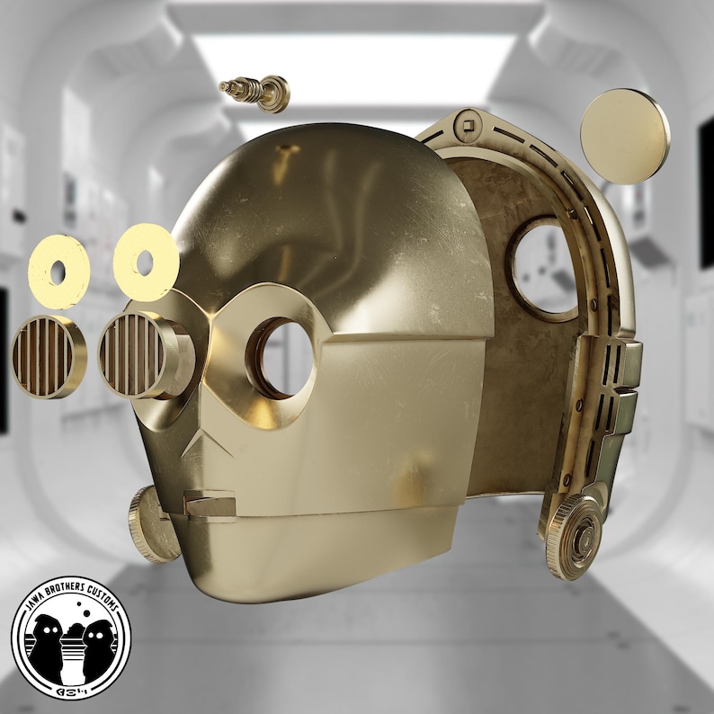 May include: A golden-colored, metallic robot head with various detached components. The head has large eye sockets and a detailed, segmented design. Additional parts include circular and cylindrical pieces, and a small screw. The Jawa Brothers Customs logo is in the lower left.