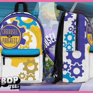 May include: A white backpack with a purple, blue, and yellow design. The backpack has a large graphic of a circle with the text "Carousel of Progress" inside. The backpack also has a smaller pocket on the front with a zipper. The text "BBOP TEES" is printed on the bottom of the backpack.