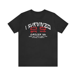 May include: Black t-shirt with white text that reads "I Survived Order 66 (And all I got was this stupid t-shirt)". The number 66 is in red with a dripping blood effect.