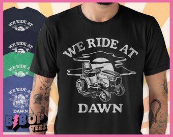 Dad Shirt We Ride at Dawn Dad Lawncare Gardener Mower Cowboy Unisex Tee