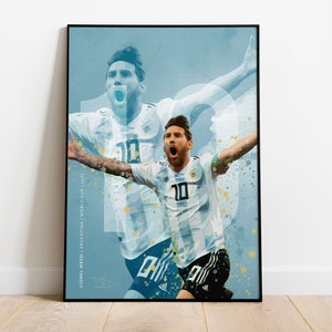 May include: A digital illustration of Lionel Messi in a white and light blue soccer jersey with the number 10 on the front. The background is a blue and white watercolor effect with gold splatters. The text "Lionel Messi / Argentina / World Cup 2022" is in the lower left corner.