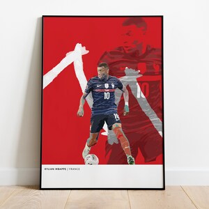 May include: A red and white abstract graphic poster featuring a soccer player in a blue jersey with the number 10 on it. The text "KYLIAN MBAPPE | FRANCE" is at the bottom of the poster.