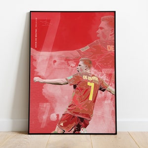 May include: A digital illustration of a soccer player wearing a red and yellow jersey with the number 7 on the back. The player is in mid-stride, kicking the ball. The background is a red and white abstract design. The text "KEVIN DE BRUYNE / BELGIUM" is on the left side of the image.