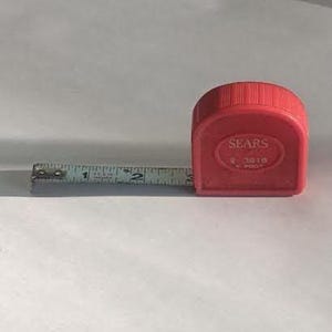 Sears 6-foot Pocket Tape Measure in a red plastic casing, model #9 3916, 1960's.