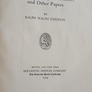 May include: An open book displaying the title "The Conduct of Life and Natural History of Intellect and Other Papers" by Ralph Waldo Emerson. Published by Houghton Mifflin Company in 1929. The Harvard Edition is printed at the top.